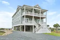 1354 Ocean Boulevard W, Holden Beach, NC 28462 — 6-bedroom waterfront home in Holden Beach West, Holden Beach, NC, photo 1 of 77