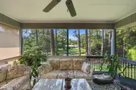22 Pine Lake Drive, Whispering Pines, NC 28327 — 3-bedroom waterfront home in Pine Lakes, Whispering Pines, NC, photo 5 of 53: Screened Porch Overlooking the Water