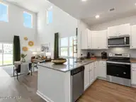 4242 Allsbrook Lane Unit 1010, Leland, NC 28451 — 3-bedroom townhome in Indigo Preserve, Leland, NC, photo 11 of 43: Overlooking the Living Room