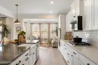 6711 Fellowship Drive, Leland, NC 28451 — 5-bedroom home in Grand Park, Leland, NC, photo 21 of 49: Kitchen to Sunroom - Yates II B - Foxhal