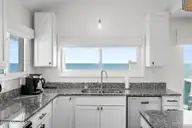 7313 Ocean Drive, Emerald Isle, NC 28594 — 5-bedroom waterfront home in Oakland Hills, Emerald Isle, NC, photo 21 of 66: Kitchen View 7