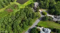 125 Evergreen Drive, Wallace, NC 28466 — lot in River Landing, Wallace, NC, photo 1 of 10: DJI_20250813100633_0507_D