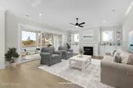 535 Sheldrake Court, Beaufort, NC 28516 — 4-bedroom home in Beau Coast, Beaufort, NC, photo 2 of 53: Living Room w/ Fireplace & Water View