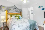 124 NE 15th Street, Oak Island, NC 28465 — 3-bedroom home in Long Beach, Oak Island, NC, photo 19 of 51: thumbnail-0196a7bd-0369-715c-a24b-6bac16