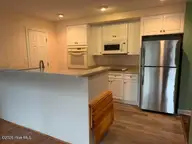 120 Sandham Court, Seven Lakes, NC 27376 — 2-bedroom townhome in Seven Lakes South, Seven Lakes, NC, photo 13 of 33: Kitchen