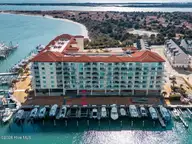 100 Olde Towne Yacht Club Drive U212, Beaufort, NC 28516 — 3-bedroom waterfront condo in Olde Towne Condo, Beaufort, NC, photo 2 of 27: Aerial_Front w slip