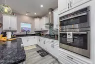 456 Pointe Vista Drive, Elizabeth City, NC 27909 — 4-bedroom waterfront home in The Waters At Sunset Pointe, Elizabeth City, NC, photo 21 of 49: 15-456 Pointe Vista - Kitchen-3