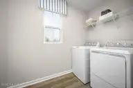 8131 Sterling Oaks Drive NW, Ash, NC 28420 — 3-bedroom home in Sterling Oaks, Ash, NC, photo 4 of 15: Laundry