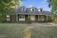 209 Brentwood Drive N, Wilson, NC 27893 — 4-bedroom home in Brentwood Forest, Wilson, NC, photo 6 of 60: Front Porch 2