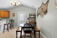 133 NE 3rd Street, Oak Island, NC 28465 — 3-bedroom home, Oak Island, NC, photo 8 of 27: Dining Area