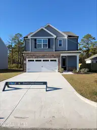 124 S Umbrella Palm Drive, Hampstead, NC 28443 — 3-bedroom home in Southwater Village, Hampstead, NC, photo 2 of 21: 124 Umbrella Palm 2