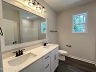 3188 Oak Drive SW, Shallotte, NC 28470 — 3-bedroom home in River Hills, Shallotte, NC, photo 11 of 28: 3188 Oak Drive Primary Suite Bath