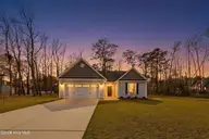 701 Boundary Loop Road NW, Calabash, NC 28467 — 3-bedroom home in Carolina Shores North, Calabash, NC, photo 1 of 40: 701BoundaryLoopRdTW