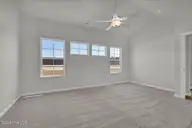 475 Galloping Foal Way SE, Bolivia, NC 28422 — 3-bedroom home in River Tide Farms, Bolivia, NC, photo 18 of 31: Primary Bedroom Windows 2
