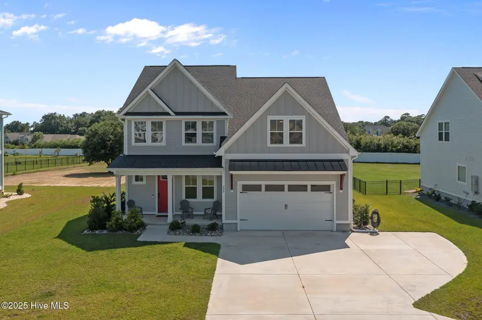 208 Coastline Circle, Cedar Point, NC 28584 — 4-bedroom waterfront home in Bridge View, Cedar Point, NC, photo 1 of 66: 1-web-or-mls-DJI_0704