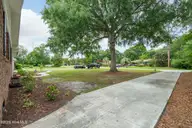 810 Bragg Drive, Wilmington, NC 28409 — 3-bedroom home in Pine Valley Estates, Wilmington, NC, photo 9 of 68: Second Driveway to Workshop