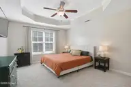 404 Hidden Oaks Drive, Jacksonville, NC 28546 — 3-bedroom home in Hunters Creek, Jacksonville, NC, photo 15 of 28: Spacious bedroom with warm neutrals