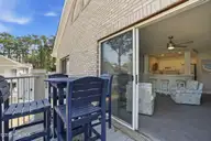 908 Resort Circle Unit 510, Sunset Beach, NC 28468 — 1-bedroom condo in Colony II, Sunset Beach, NC, photo 18 of 30: Shady balcony
