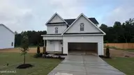 648 Springtooth Drive, Zebulon, NC 27597 — 3-bedroom home in Harvest Meadows, Zebulon, NC, photo 1 of 7: Construction