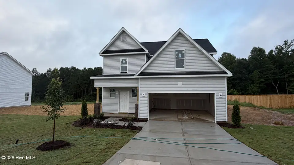 648 Springtooth Drive, Zebulon, NC 27597 — 3-bedroom home in Harvest Meadows, Zebulon, NC, photo 1 of 7: Construction