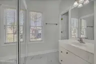 1806 Urchin Lane SE, Bolivia, NC 28422 — 3-bedroom waterfront home in Winding River Plantation, Bolivia, NC, photo 12 of 61: guest bath new tile