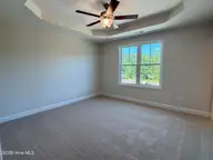100 S Bandwheel Way, Hampstead, NC 28443 — 3-bedroom home in Sawyers Run, Hampstead, NC, photo 10 of 20: primary bedroom