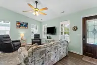 316 NE 52nd Street, Oak Island, NC 28465 — 3-bedroom home in Tranquil Harbor, Oak Island, NC, photo 16 of 49: 12_living room