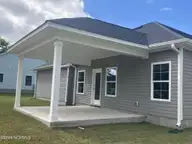 1306 Caracara Drive Model Home, New Bern, NC 28560 — 4-bedroom waterfront home in Fairfield Harbour, New Bern, NC, photo 3 of 24: Covered Patio