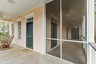 5022 Walton Street, Shallotte, NC 28470 — 2-bedroom home in The Village of Woodsong, Shallotte, NC, photo 7 of 38: Wrap around porch