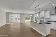 160 Planters Walk, Hampstead, NC 28443 — 4-bedroom waterfront home in East Wynd, Hampstead, NC, photo 6 of 32: Living room 1