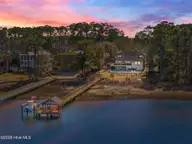 2502 W Yacht Drive, Oak Island, NC 28465 — 4-bedroom waterfront home, Oak Island, NC, photo 1 of 50: 4-web-or-mls-DJI_20260224131001_0616_D_2