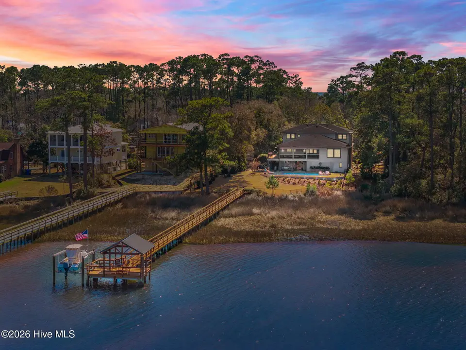 2502 W Yacht Drive, Oak Island, NC 28465 — 4-bedroom waterfront home, Oak Island, NC, photo 1 of 50: 4-web-or-mls-DJI_20260224131001_0616_D_2