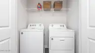 221 Maddox Drive, Aberdeen, NC 28315 — 3-bedroom townhome in Martin Farms, Aberdeen, NC, photo 22 of 23: Laundry Room