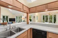 579 Coral Ridge Road, Pine Knoll Shores, NC 28512 — 4-bedroom waterfront home in Beacon's Reach, Pine Knoll Shores, NC, photo 12 of 62: Kitchen w/ Abundant Natural Lighting
