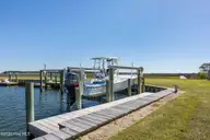 1711 E Fort Macon Road, Atlantic Beach, NC 28512 — 4-bedroom waterfront home in Asbury Beach, Atlantic Beach, NC, photo 3 of 42: 25 ft Boat Lift