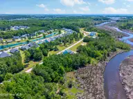 232 1009 Kings Creek Crossing, Holly Ridge, NC 28445 — waterfront lot in Summerhouse On Everett Bay, Holly Ridge, NC, photo 10 of 30: Lot 1009-232 Kings Creek Crossing MLS-13