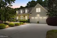 2668 Parkridge Drive, Southport, NC 28461 — 4-bedroom home in St James, Southport, NC, photo 6 of 77: Twilight shot