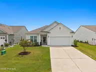 9414 Barnstormer Drive, Carolina Shores, NC 28467 — 3-bedroom waterfront home in Eagle Run, Carolina Shores, NC, photo 1 of 41: Front View