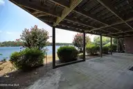 7 Lake Vista Lane, Pinehurst, NC 28374 — 3-bedroom waterfront home in Unit 13, Pinehurst, NC, photo 15 of 42: 18LowerPatio