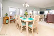 1131 S Shore Drive, Surf City, NC 28445 — 4-bedroom waterfront home in Horse Hammock, Surf City, NC, photo 6 of 40: Dining II