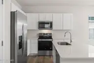1063 Hanson Drive, Leland, NC 28451 — 3-bedroom home in East Lake, Leland, NC, photo 10 of 34: Large Island with Quartz Countertops
