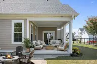 658 Fishermans Point, Newport, NC 28570 — 4-bedroom home in Bogue Watch, Newport, NC, photo 19 of 48: Coastal patio with fire pit and flowers
