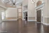 1614 Colonist Square SW, Ocean Isle Beach, NC 28469 — 3-bedroom home in Brick Landing, Ocean Isle Beach, NC, photo 14 of 63: Formal LR to DR