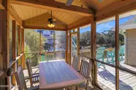 106 Cherry Court, Pine Knoll Shores, NC 28512 — 3-bedroom waterfront home in Pine Knoll Association, Pine Knoll Shores, NC, photo 7 of 63: Screened Porch
