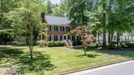 1215 Cambridge Road NW, Wilson, NC 27896 — 4-bedroom home in Woodridge, Wilson, NC, photo 2 of 53: 1215-Frontyard