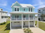 109 Ocean Bluff Drive, Indian Beach, NC 28512 — 6-bedroom waterfront home in Ocean Bluff, Indian Beach, NC, photo 2 of 57: Front Elevation