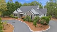209 Longleaf Drive, West End, NC 27376 — 3-bedroom waterfront home in Seven Lakes West, West End, NC, photo 1 of 62: 2-web-or-mls-DJI_20260713113901_0710_D