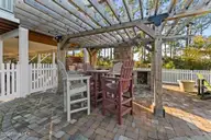 1404 W Yacht Drive, Oak Island, NC 28465 — 3-bedroom waterfront home in Pinners Point, Oak Island, NC, photo 24 of 46: Outdoor space