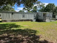 112 Pettiford Road, Peletier, NC 28584 — 3-bedroom waterfront manufactured home in Pettiford Point, Peletier, NC, photo 2 of 19: back