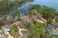 3879 Beaver Circle SW, Shallotte, NC 28470 — 3-bedroom waterfront home in Riverbend, Shallotte, NC, photo 1 of 50: 3879 Beaver Circle SW, Shallotte, NC
